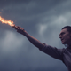 Loki holding a flaming sword.
